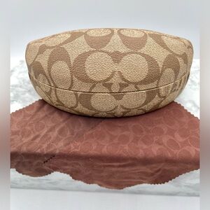 COACH Signature C Logo Hard Clamshell Sunglasses Case in Brown and Khaki.